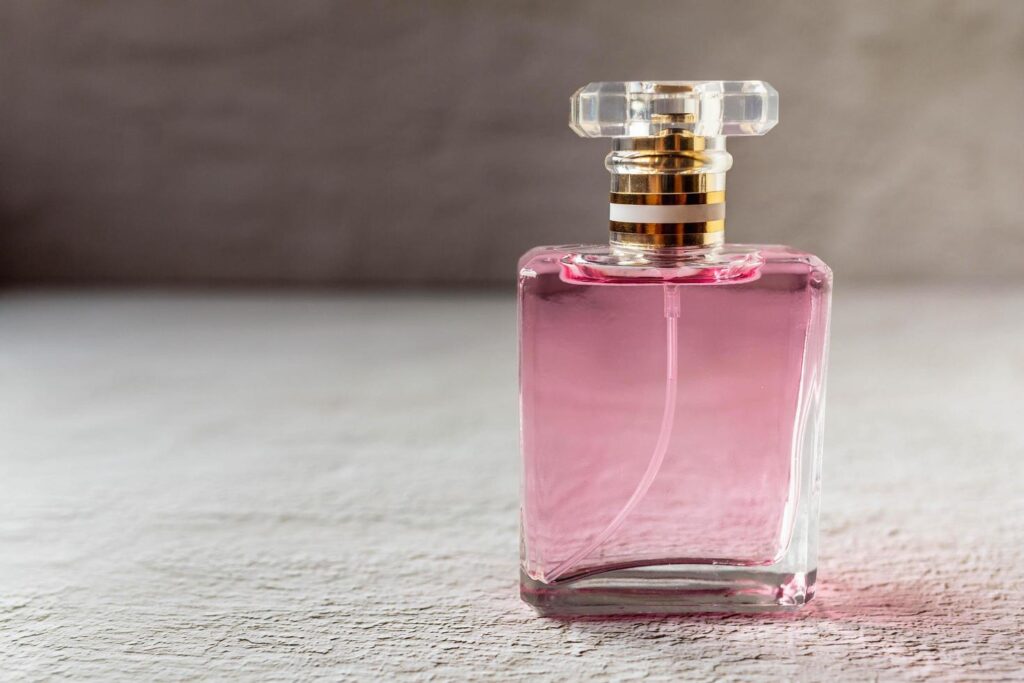 pink perfume and pink perfume bottle free photo